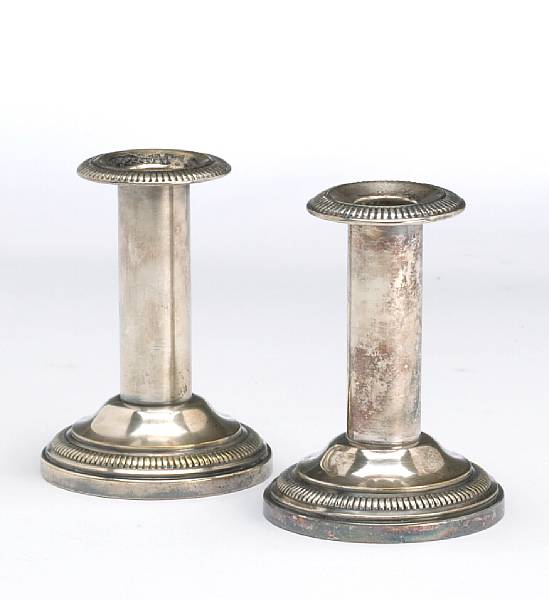 Appraisal: A continental plated pair of columnar candlesticksUnmarked th century Height