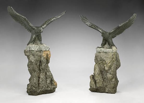 Appraisal: Two carved marble models of eagles Each landing on a