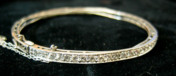 Appraisal: TIFFANY CO DIAMOND BANGLE White gold bracelet set with thirty-four