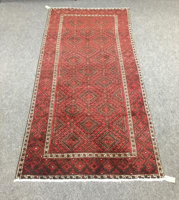 Appraisal: A Baluchi rug the red ground with all over geometric