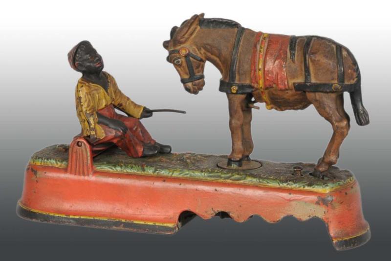 Appraisal: Cast Iron Always Did 'Spise a Mule Mechanical Bank Description