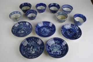 Appraisal: deep blue Staffordshire transfer dec porcelain handleless cups and saucers