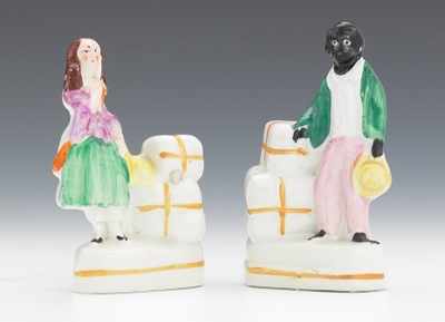 Appraisal: A Pair of Miniature Figures of Uncle Tom and Eva