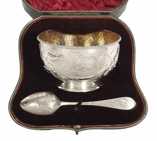 Appraisal: An Aesthetic Movement silver christening bowl and spoon by Martin