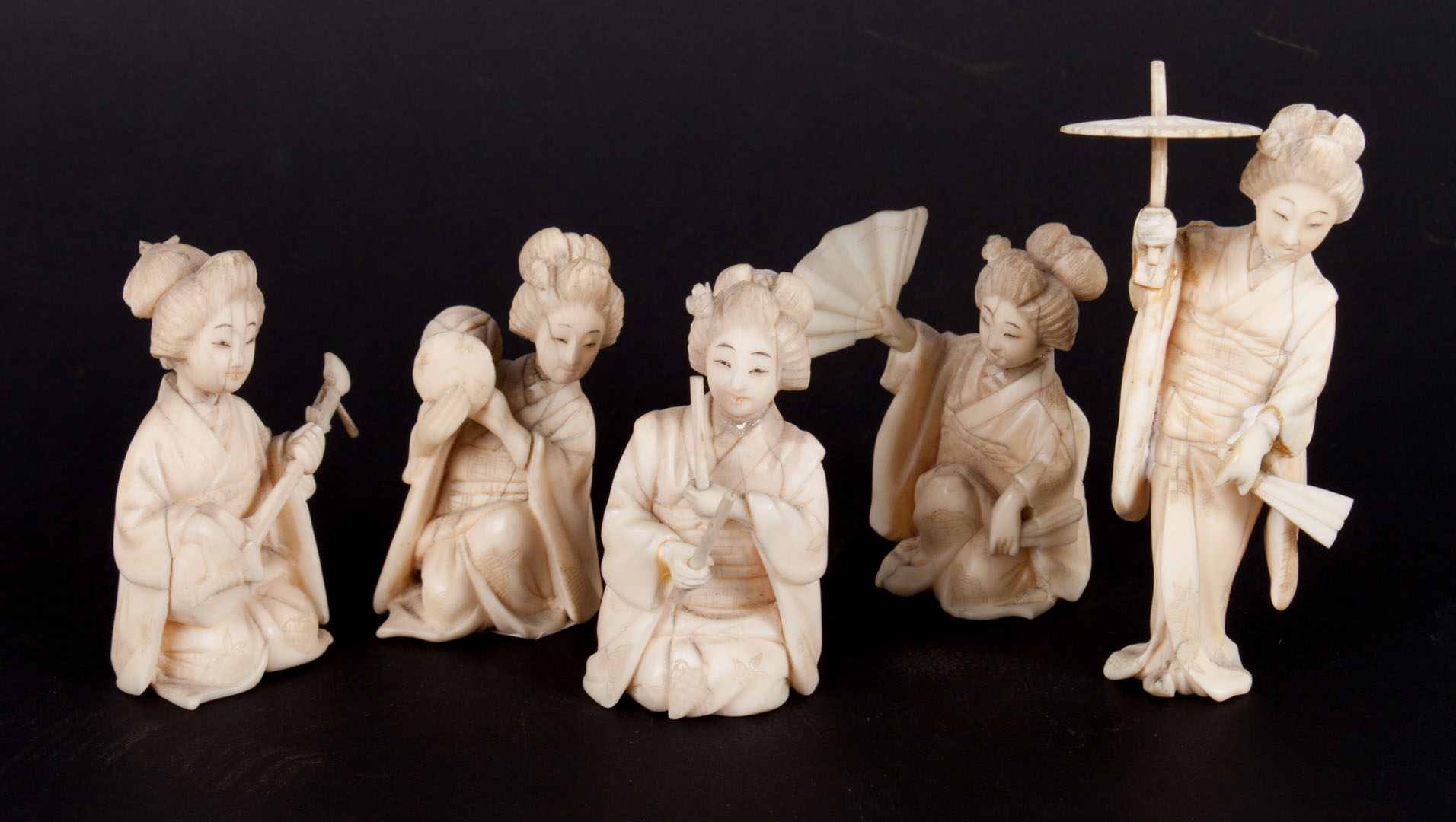 Appraisal: Five Japanese carved ivory Geisha figures including three musicians woman