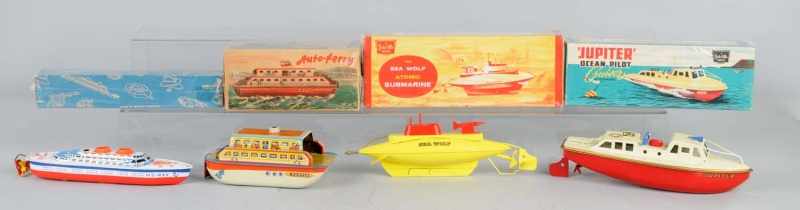 Appraisal: Lot of Tin Boat Wind-Up Toys Description English and German