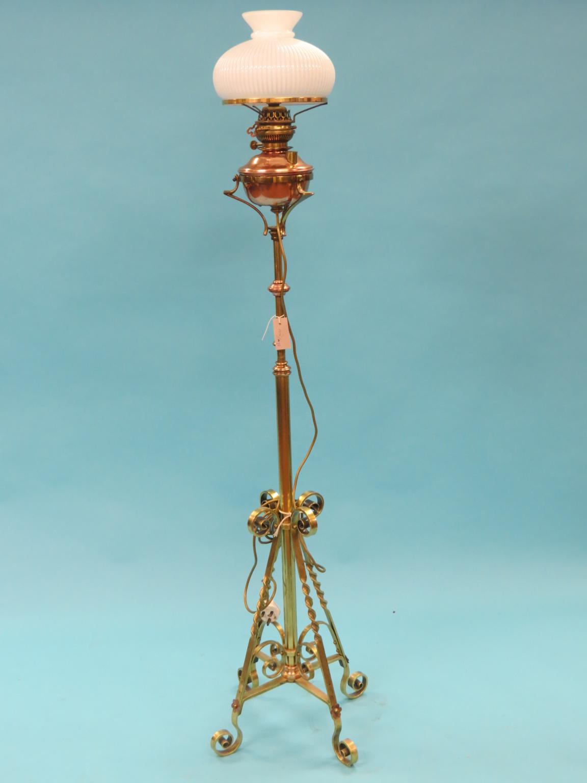 Appraisal: A Victorian brass telescopic floor-lamp with copper mounts and oil