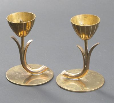 Appraisal: A pair of Ystad Sweden brass candlesticks simple tulip stem