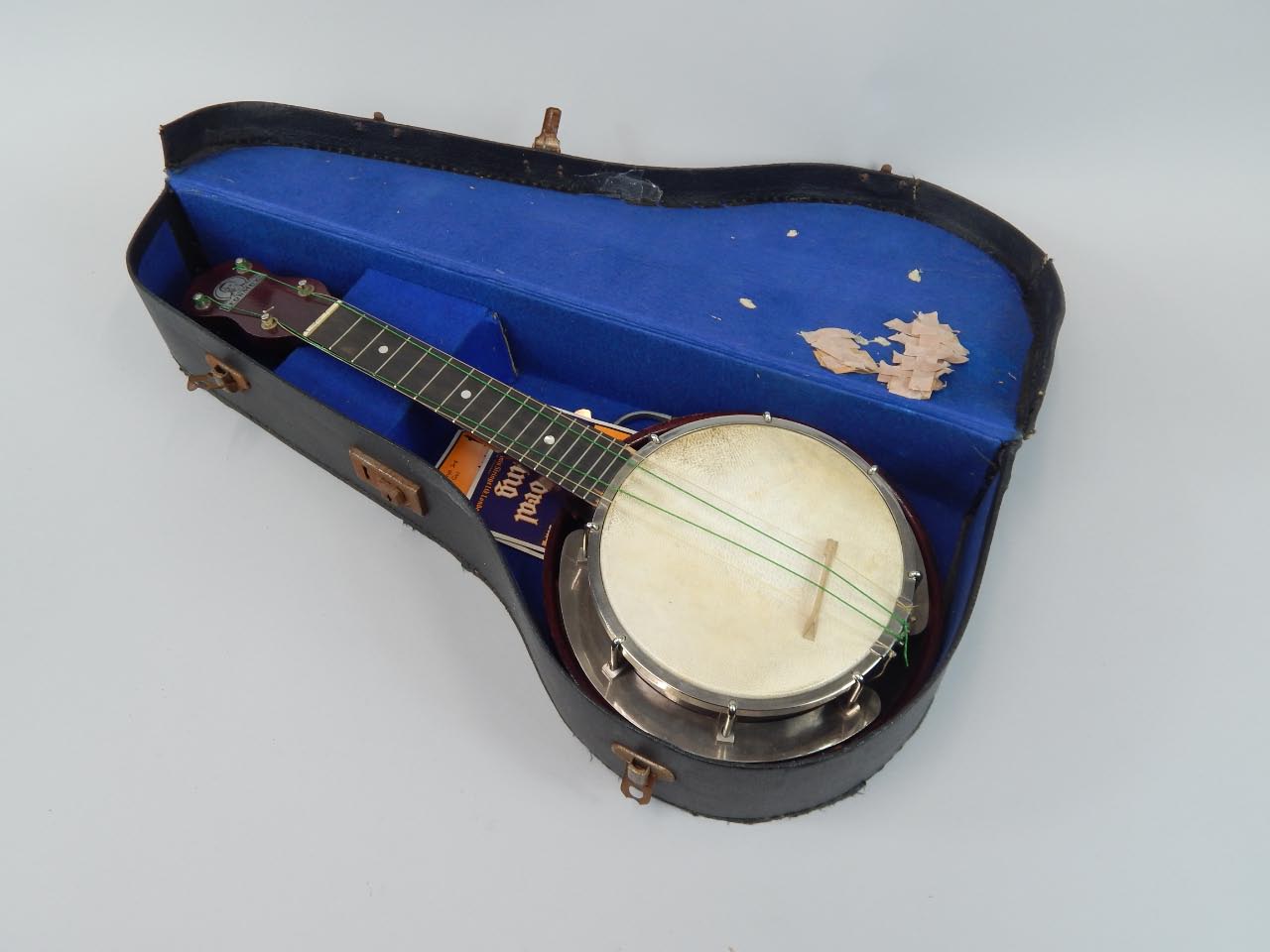 Appraisal: A thC George Formby model ukulele with hide style centre