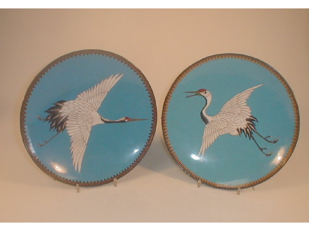 Appraisal: A pair of Chinese cloison wall plates decorated with storks