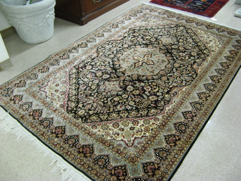 Appraisal: HAND KNOTTED ORIENTAL CARPET Indo-Persian central medallion and overall floral