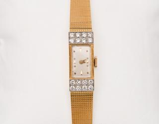 Appraisal: GIRARD K YELLOW GOLD AND DIAMOND WRISTWATCH Girard-Perregauxthe bezel featuring