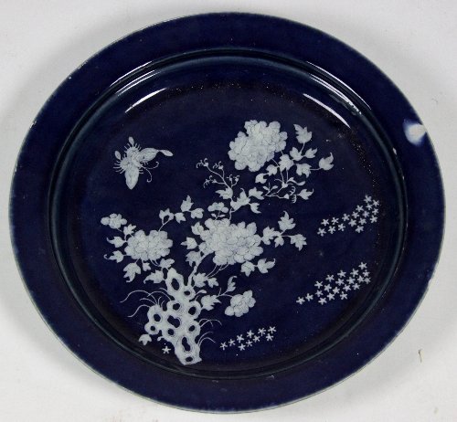 Appraisal: A Chinese circular dish th Century with white enamel flowering