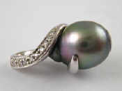 Appraisal: An carat white gold grey cultured pearl and diamond pendant