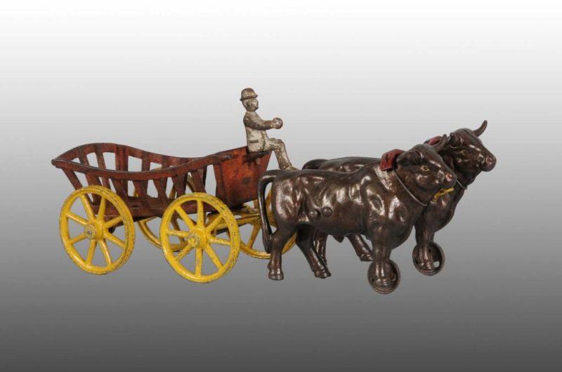 Appraisal: Cast Iron Kenton Ox Wagon Toy Description All original Size