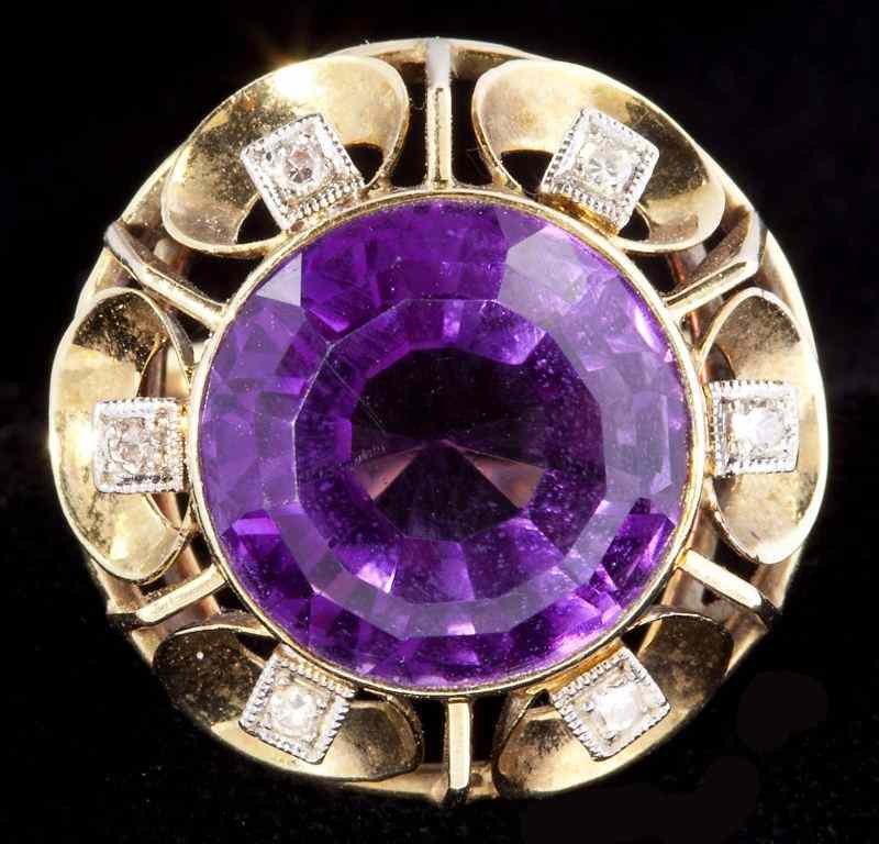 Appraisal: Amethyst and Diamond Ringcentering on one round faceted amethyst approximately