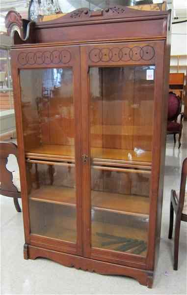 Appraisal: LATE VICTORIAN CABINET BOOKCASE American c having three adjustable wood