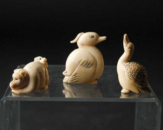 Appraisal: Three Carved Ivory Netsukes two ducks and a crouched dog