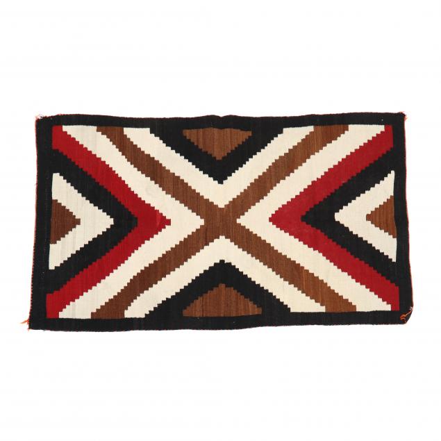 Appraisal: NAVAJO RUG Chevron motif in red black and tan