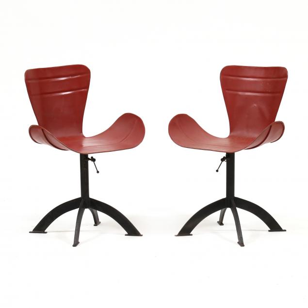 Appraisal: PAIR OF POST-MODERN INDUSTRIAL CHAIRS Circa red painted metal swivel