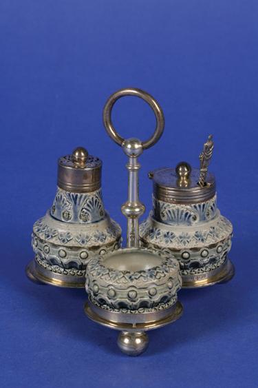 Appraisal: A MARTIN BROTHERS TABLE CRUET with impressed patterns and blue