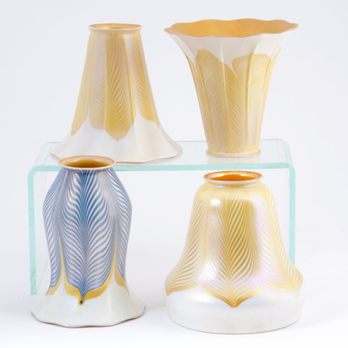 Appraisal: QUEZAL Four assorted art glass shades in gold or blue