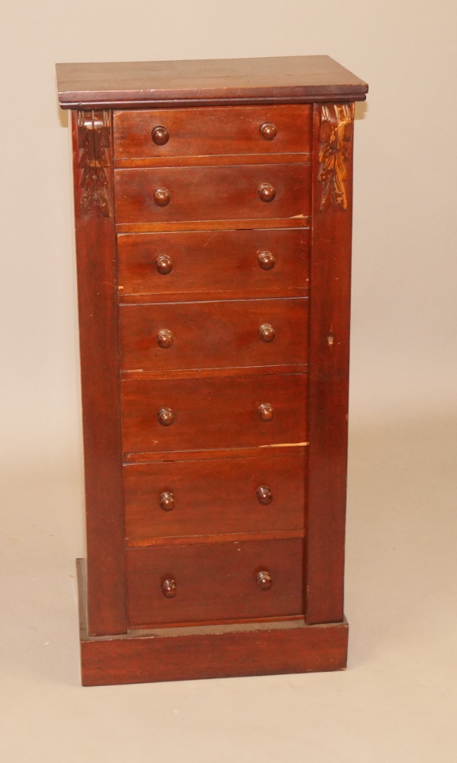 Appraisal: A Victorian mahogany Wellington chest with seven drawers each with