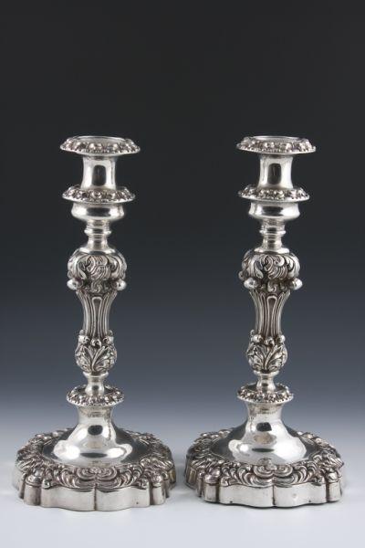 Appraisal: Pair of Rococo Style Silverplate Candlesticks th c baluster form