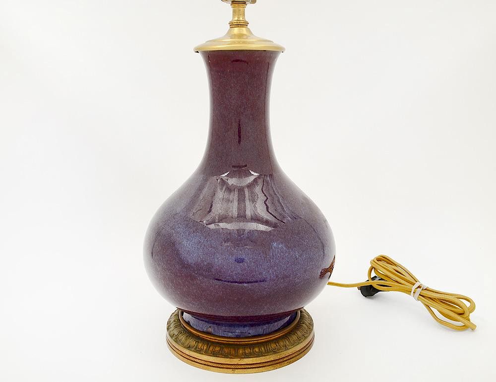 Appraisal: FLAMBE GLAZED PORCELAIN VASE Chinese Of bottle form Height Now