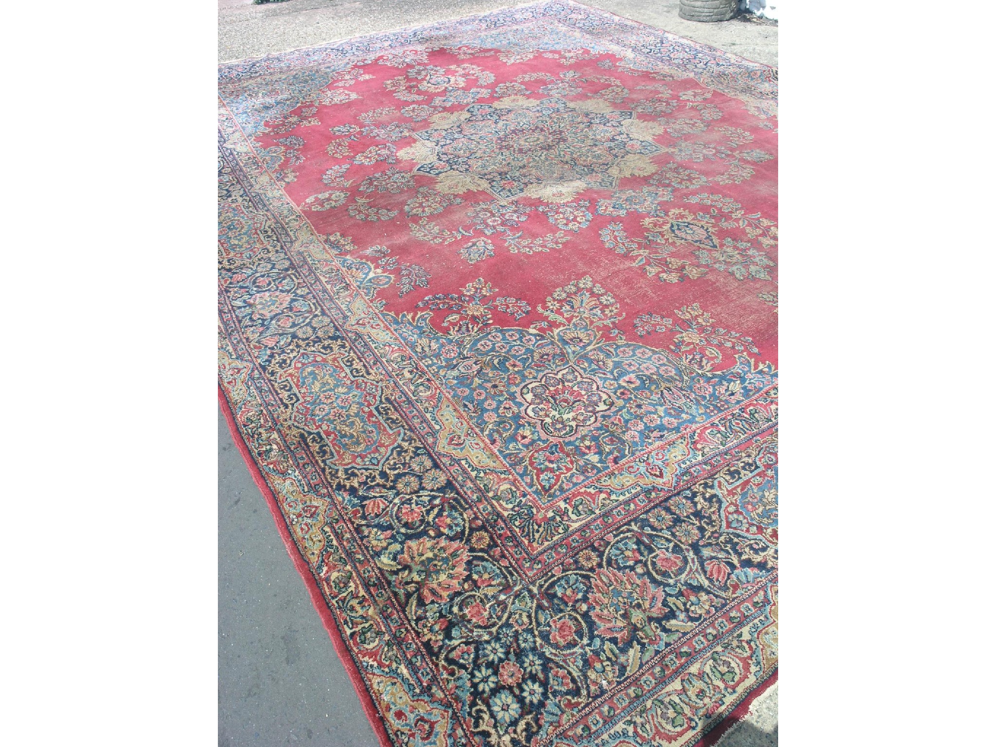 Appraisal: A Wilton wool rug floral designs predominantly in red blue