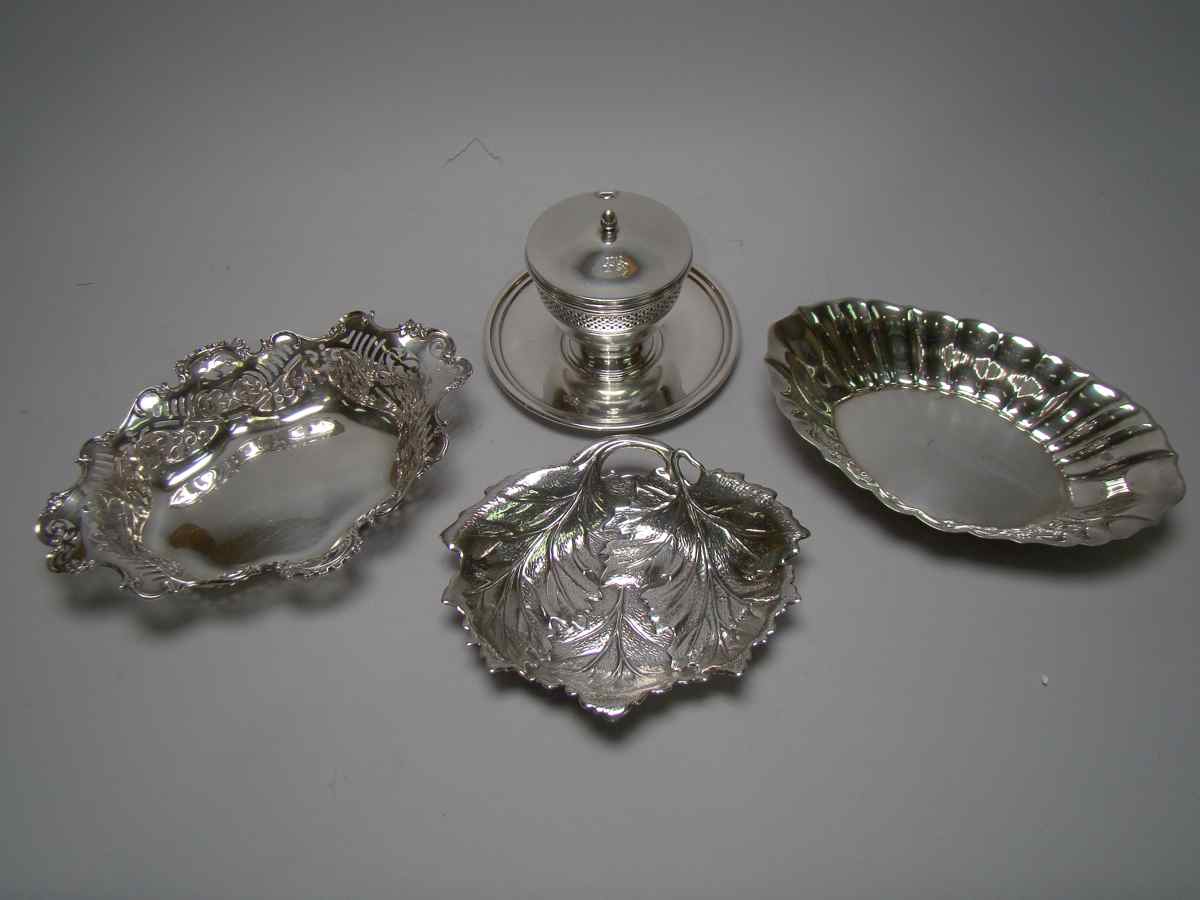 Appraisal: FOUR PIECES OF STERLING SILVER HOLLOWWARE Including a glass-lined jelly