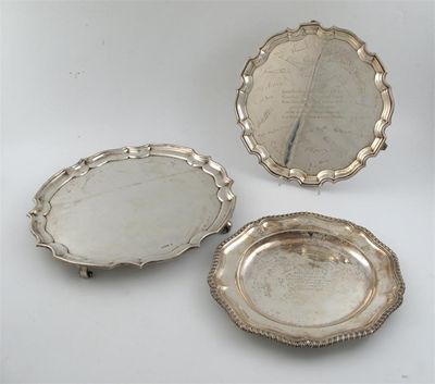 Appraisal: A modern salver shaped circular on scroll feet by J