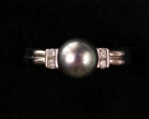 Appraisal: Black Pearl Ring with Diamond Accents Ladies white gold ring