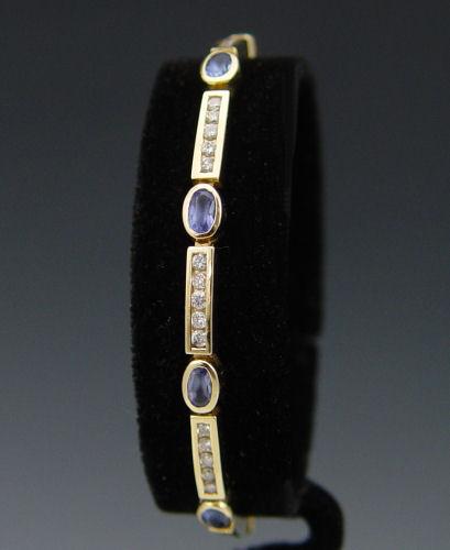 Appraisal: K TANZANITE DIAMOND BRACELET K yellow gold bracelet contains fifty