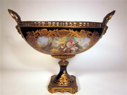 Appraisal: Sevres style porcelain and gilt bronze mounted centerpiece The pierced