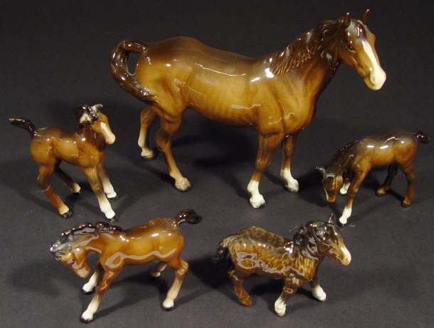 Appraisal: Five Beswick horses and foals each with hand painted brown