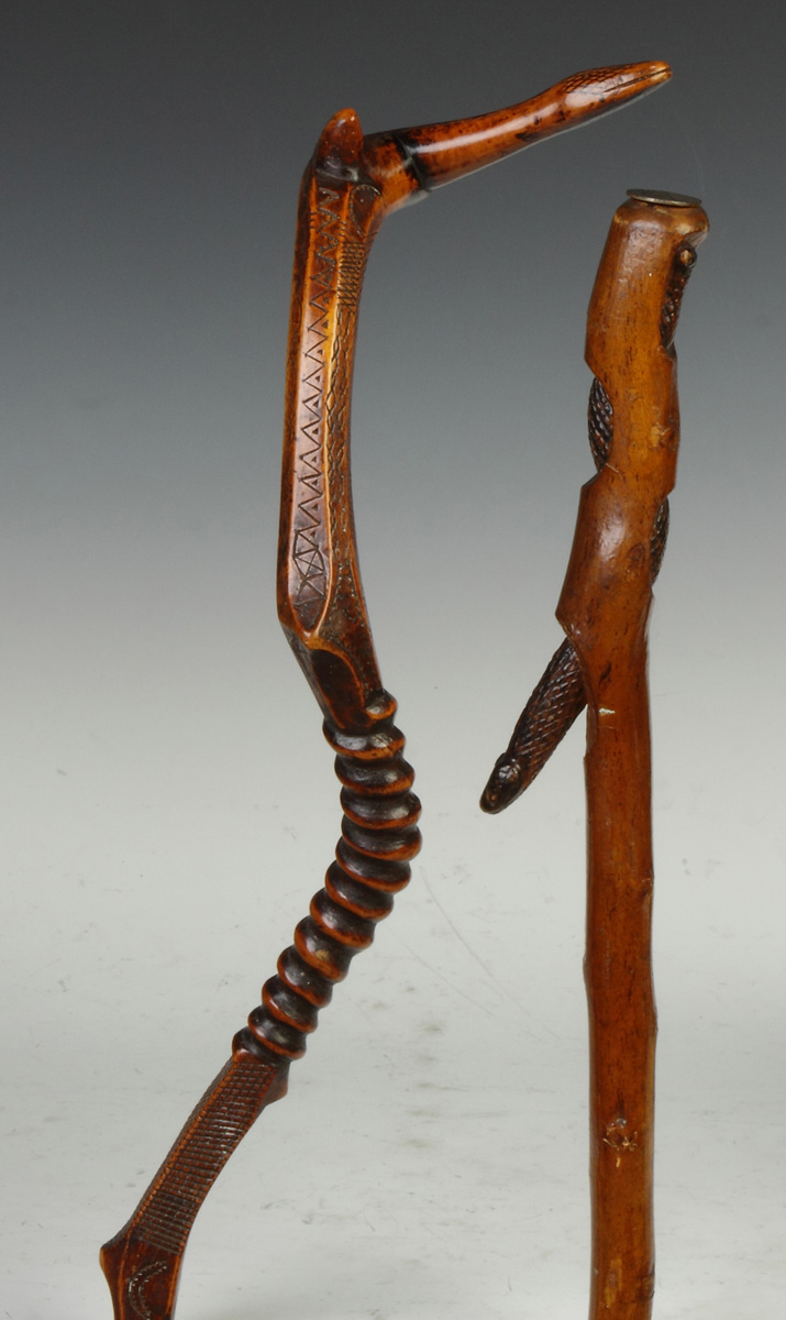 Appraisal: Two Carved Wood Snake Canes L Initialed JB birds horse