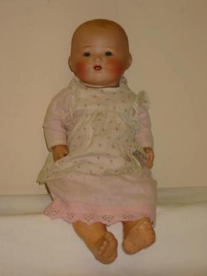 Appraisal: An Armand Marseille bisque head baby doll with blue glass