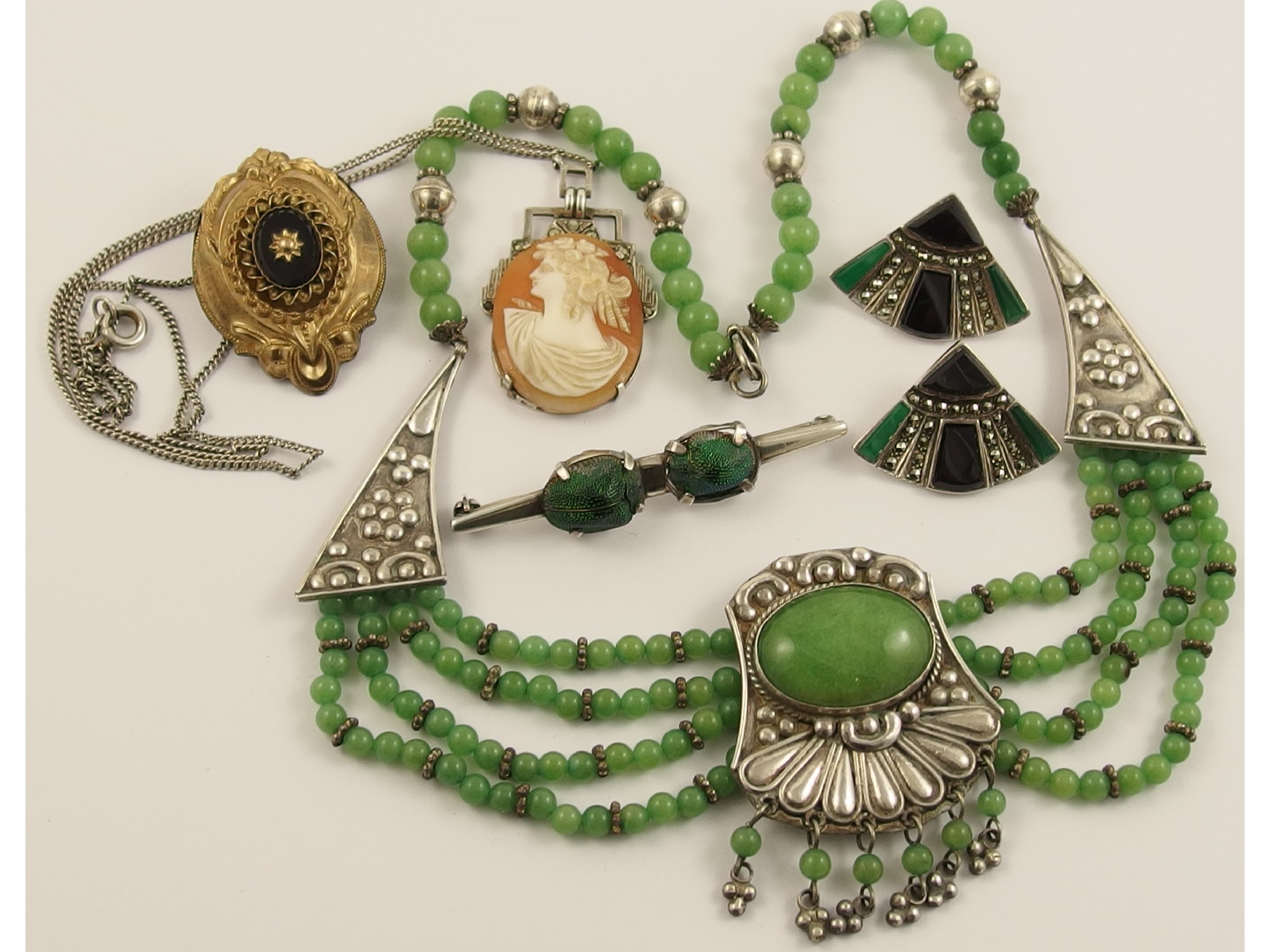 Appraisal: A silver and Chinese green hardstone necklace a silver beetle