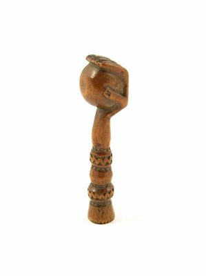 Appraisal: A mid th century carved treen pipe tamper of a