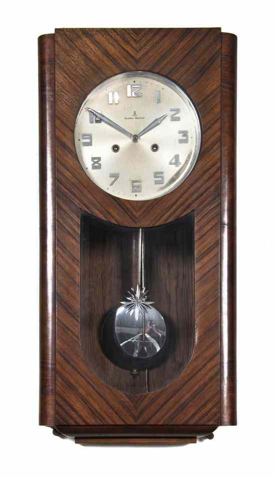 Appraisal: An Art Deco Style Regulator Clock Gustave Becker the circular