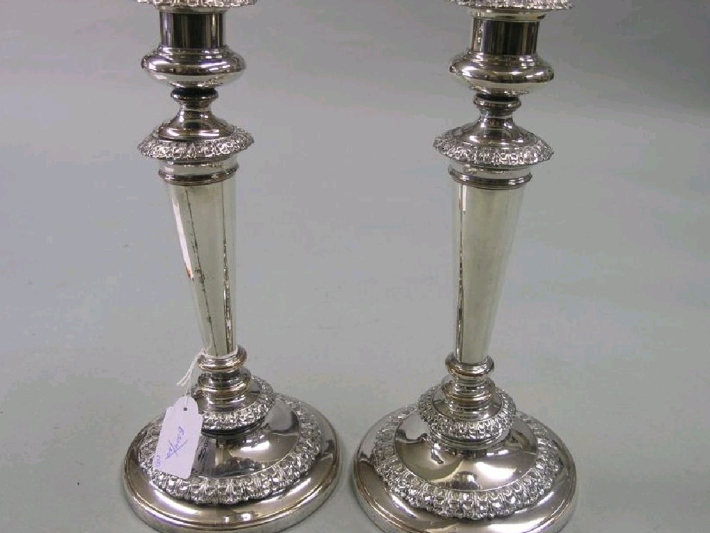 Appraisal: A pair of early th century Old Sheffield Plate candlesticks