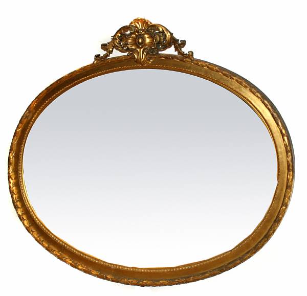 Appraisal: A French carved giltwood oval mirror height in width in