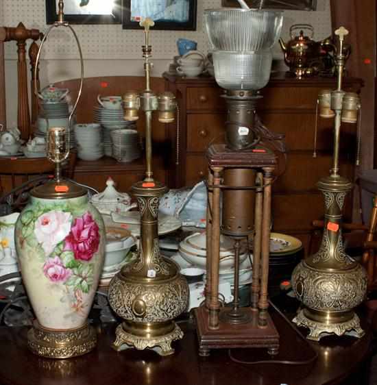 Appraisal: Pair of brass bottle-form lamps floral decorated ceramic vase mounted