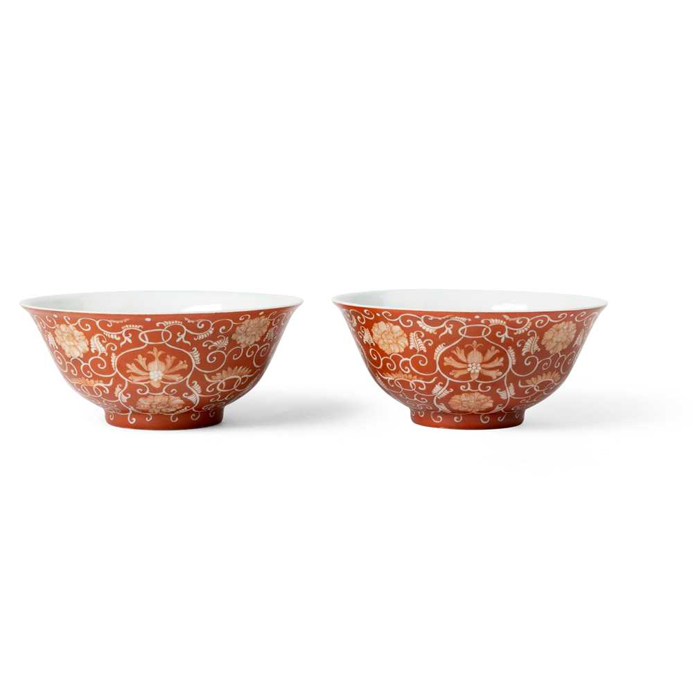 Appraisal: PAIR OF CORAL-GROUND RESERVE-DECORATED 'LOTUS' BOWLS DAOGUANG MARK AND POSSIBLY