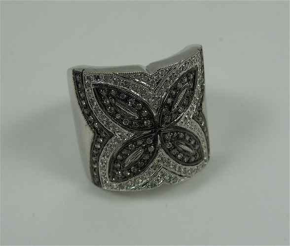 Appraisal: DIAMOND AND K WHITE AND BLACKENED GOLD RING the top