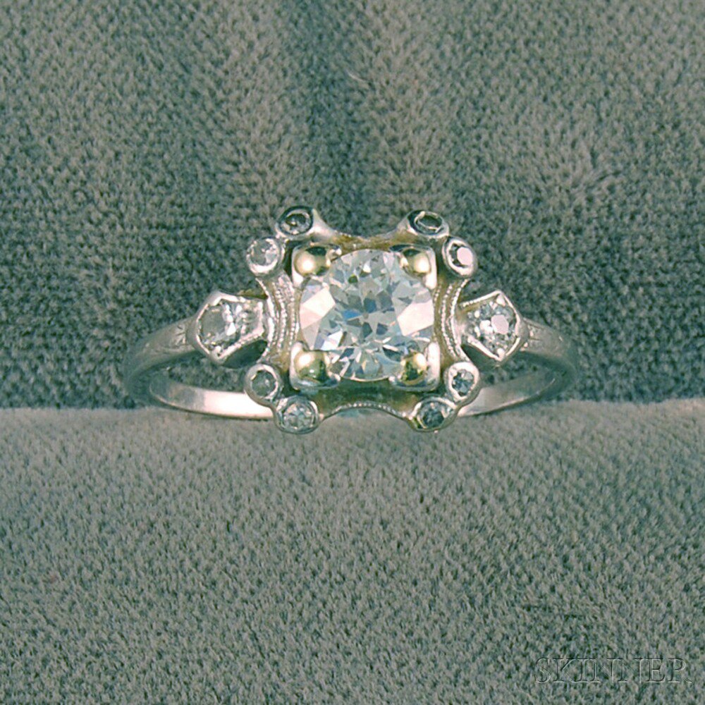 Appraisal: Platinum and Diamond Ring the central round-cut diamond in square