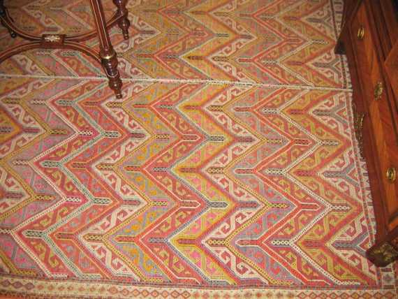 Appraisal: SILEH KILIM old Colourful geometrically patterned central field white border