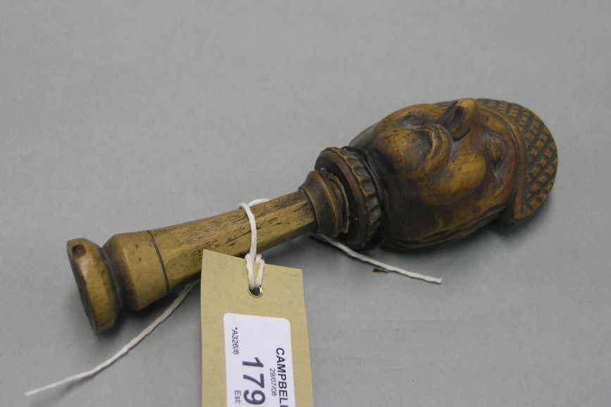 Appraisal: A th century carved wood nutcracker in the form of