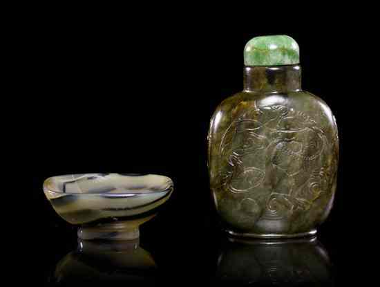 Appraisal: A Hardstone Snuff Bottle having relief carving of a dragon